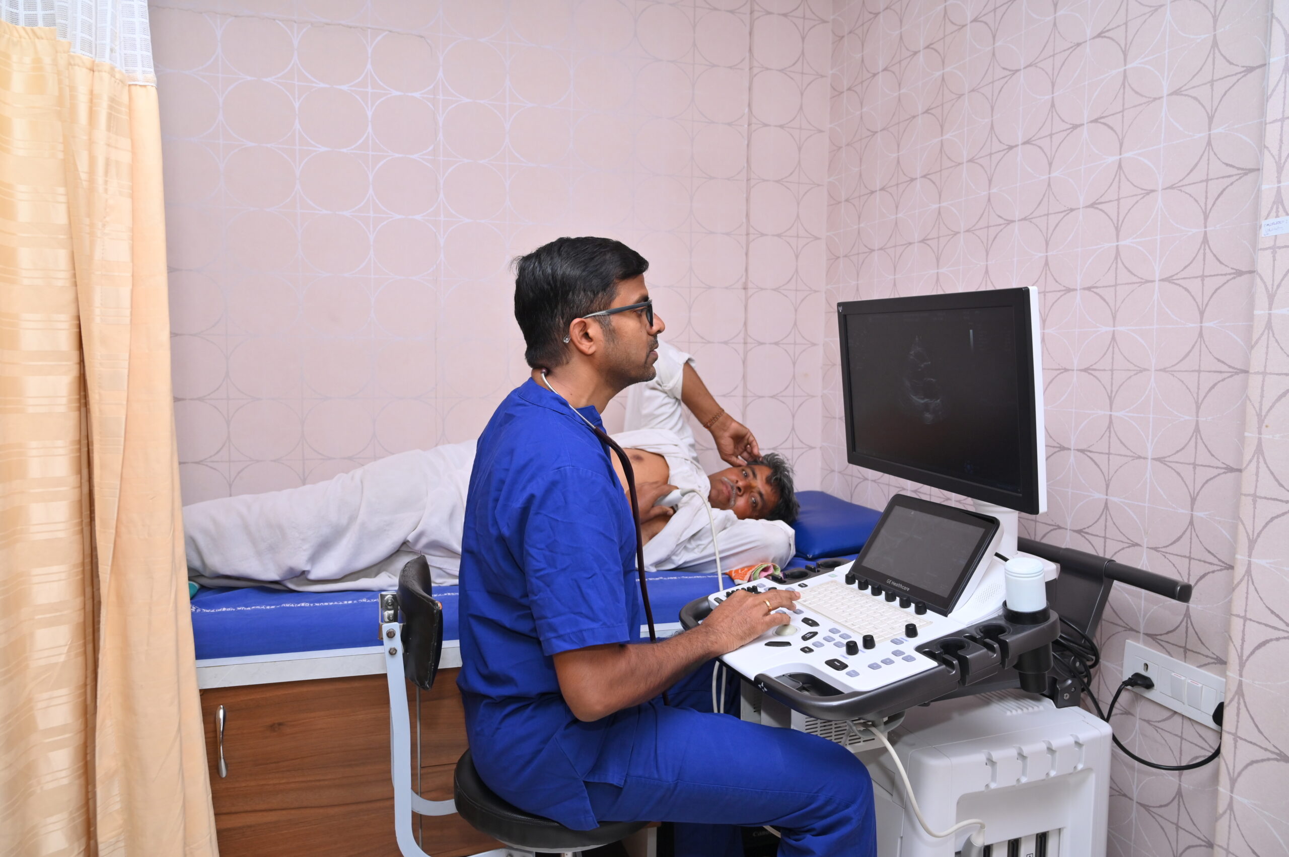 ICU nurse attending to critical care patient